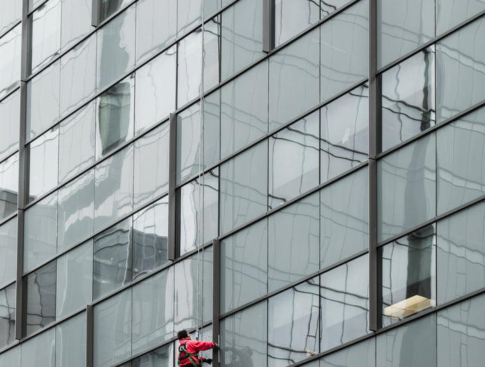 Header image of a news section showing a glass skyscraper by Gladwell Glass